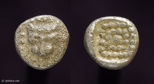 [Image: Silver dotted lion-mask coins.]