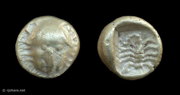 [Image: Electrum lion/scorpion coin of ancient Asia Minor.]