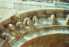 Decorated arch with faces