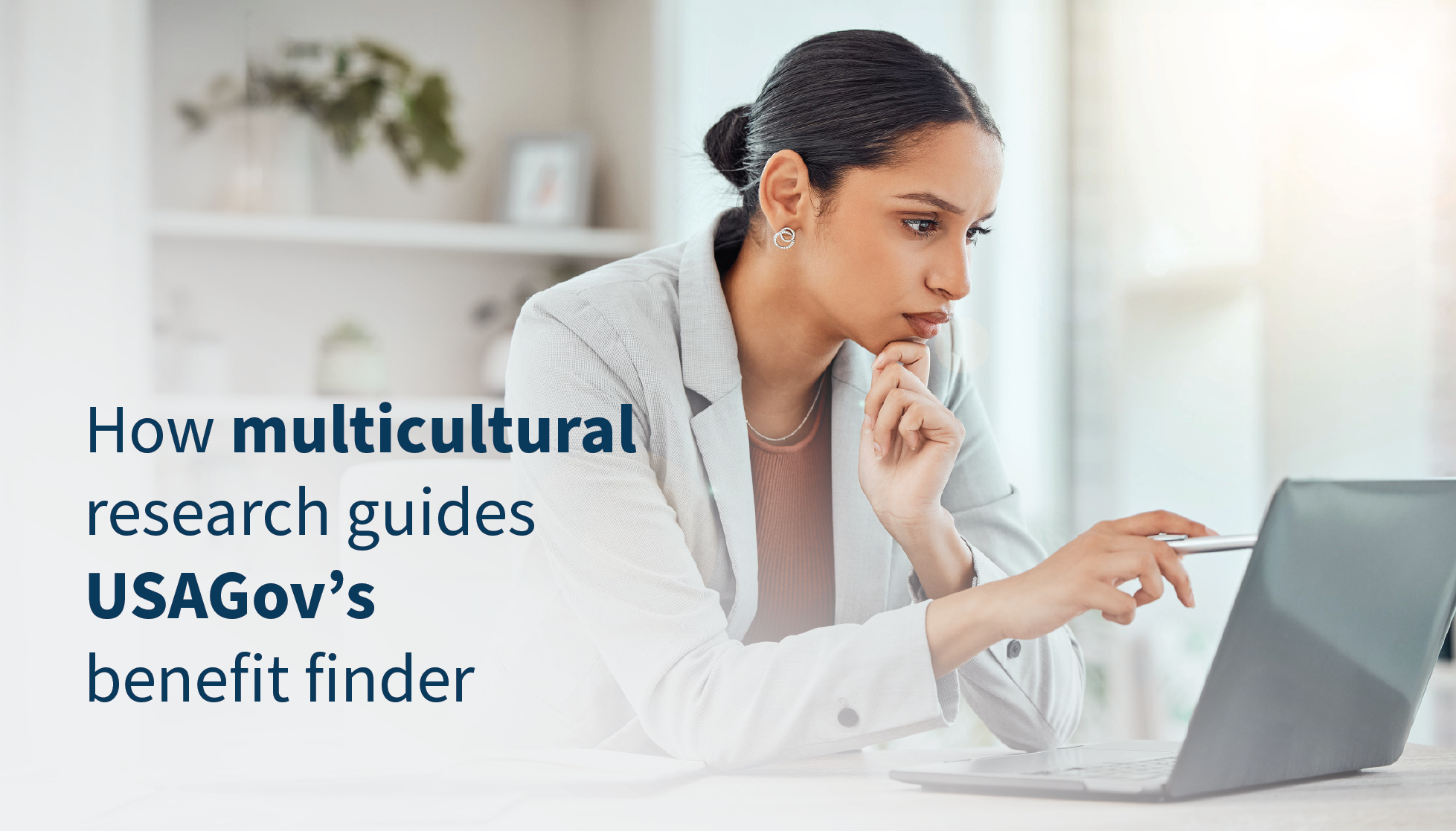 A business woman looks closely at her laptop at home next to the text "How multicultural research guides USAGov's benefit finder"