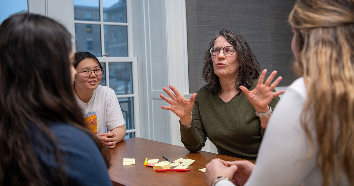 Professor Sassler meeting with policy students
