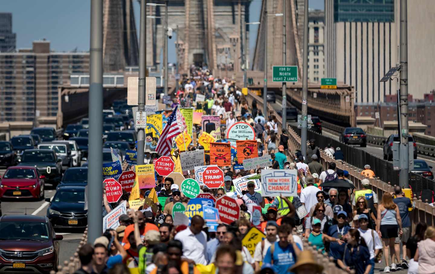 Climate activists march across the Brooklyn Bridge to demand that New York Governor Kathy Hochul stop the construction of the Williams Pipeline in New York City on August 9, 2025.
